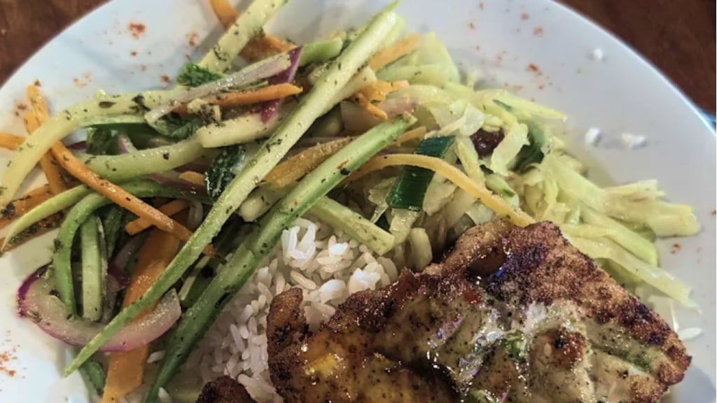 trying Snapper dish in Costa Rica